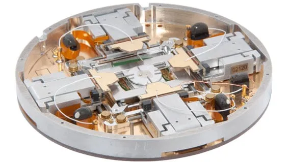 Underside view of the PS4 platform showing the internal cabling and drive assemblies beneath the manipulators.