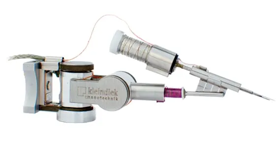 The GIS-EM gas-injection plug-in on a Kleindiek micromanipulator, showing the heated precursor reservoir, fine heater wiring and the injection needle.