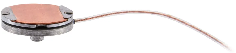 Side view of the MHS stage — a copper-topped cylindrical stub with a braided signal cable — on a white background.