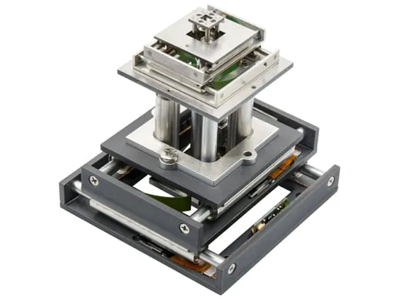 The 6-Axis Alignment Stage — two three-axis stages stacked one above the other, a tall post-mounted upper stage on a wider lower frame.